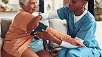Nursing home, senior woman and check blood pressure for cardiovascular health, wellness and measure heart rate. Caregiver, hands and cuff for medical test, hypertension exam and help in retirement