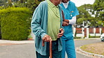 Nurse, senior man and walking stick outdoor with mobility support, helping hand and exercise in neighborhood. Retirement, caregiver and elderly person with cane for rehabilitation and recovery help
