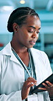 Research, scientist and black woman in lab, tablet and typing with report for pharmaceuticals results. African person, drug trail or employee in workplace, tech or app for vaccine development or cure