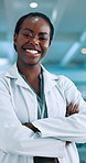 Happy, black woman or scientist with confidence at lab for medical, research and development. Portrait, female person or health worker with smile or arms crossed for professional career in science