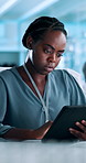 Black woman, scientist and browsing with tablet at laboratory for medical research or data analysis. Female person, health worker or biologist with technology or app for online discovery or new study