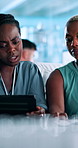 Tablet, meeting and business women in office in collaboration with coding challenge. Feedback, digital technology and female software developers working on UX design project together in workplace.