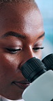 Black woman, scientist and research with microscope for medical discovery or forensic science at lab. Female person, health worker or biologist with technology for microscopic examination or results