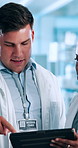 Man, scientist and meeting with tablet for discussion or medical research at laboratory. Male person, technology and planning with team, health app or data for scientific results, test or exam