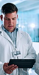 Man, scientist and research with tablet for results, scientific analysis or project discussion at lab. Male person, team or group of health workers with technology for exam, test or science discovery