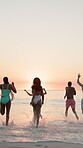 Running, sea and back of friends at beach for summer vacation, travel adventure and freedom. Tropical destination, sunset and celebration with group of people for tourism, holiday and bonding