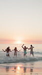 Running, sea and travel with friends at beach for summer vacation, adventure and freedom. Tropical destination, sunset and celebration with back of group of people for tourism, holiday and bonding