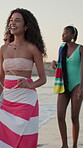 Smile, walking and travel with friends at beach for summer vacation, adventure and happy. Tropical destination, trip and break with group of people in nature for tourism, holiday and bonding together