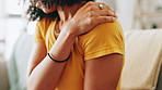 Home, hands and woman with shoulder pain, tired and joint injury with stress, muscle tension and fatigue. Closeup, apartment and person on sofa, inflammation and ache with bad posture or osteoporosis