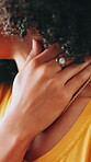 Hands, neck pain and posture with person on sofa in living room of home for injury or massage. Accident, muscle fatigue and tension with woman closeup in apartment for inflammation or recovery