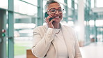 Mature business woman, phone call and happy in lobby with contact for b2b networking, deal or investing at company. Person, smartphone and smile with talking, financial advice and feedback at agency