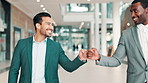 Fist bump, walking and business men in lobby for greeting, hello and friends in workplace. Professional, corporate workers and happy people with hand gesture for career, job and welcome in office