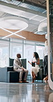 Talking, introduction and people in lobby for business, schedule update or conference hall. Staff, project and keynote speaker with assistant in modern office for networking, seminar or career event