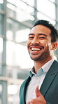 Happy, wink and face of businessman in airport with confidence for corporate travel. Smile, thumbs up and portrait of male investment banker from Brazil with pride for work trip in lobby of hotel