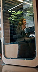 Business woman, video call and cubicle for communication, webinar or chat at internet cafe. Female person, employee or freelancer talking with sound proof glass for clear connection or negotiation