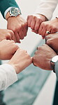 Business people, hands and fist bump in office for teamwork, company collaboration and support. Corporate group, circle and above in workplace for partnership, campaign involvement and cooperation