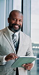 Face, corporate and black man with tablet in office for reading email, financial report and proposal. Portrait, accountant and walk with digital for schedule, budget planning and investment feedback