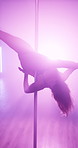 Spotlight, club and pole dancing with woman at night for stripper, exotic performance and neon. Lingerie, seductive and private dancer with person in studio for burlesque, entertainment and stage