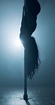 Woman, night and upside down dancer on pole for private performance, party or flexibility in strip club. Artist, performer or sensual movement dancing in lingerie for entertainment, show or burlesque