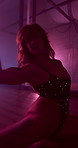 Woman, night and dancer on floor for performance, VIP party and exotic entertainment in strip club. Show, performer and girl in sensual movement dancing in lingerie for desire, fantasy and burlesque