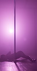 Silhouette, floor and pole dancing with woman at night for stripper, exotic performance and spotlight. Neon, seductive and private dancer with person in studio for burlesque, entertainment and stage