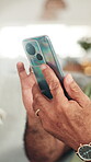 Hands, phone and text message with person in home for communication, networking or search. App, connectivity and social media with mobile user closeup in apartment for contact, reading or typing