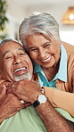 Senior, happy couple and face with hug on sofa for love, old romance or affection together at home. Portrait, elderly man and woman with smile or embrace in joy for support, marriage or commitment