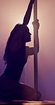 Pole dancing, neon light and woman with performance, sexy and flexible stripper on floor. Erotic dancer, person or moving to music for burlesque, sensual art and exotic entertainment in night club