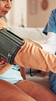 Blood pressure, home and nurse with senior woman for medical service, exam and consulting. Healthcare, retirement and caregiver and elderly patient with pump for diabetes, heart rate and hypertension