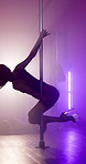 Girl, pole dance and spin at club, performance and creative with neon, smoke and burlesque concert. Woman, exotic dancer and swivel for private show, stretching or fantasy with stage light for talent