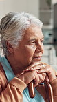 Senior woman, stress and thinking with cane in retirement home for grief, loss and nostalgia with memory. Lonely, elderly person and thoughtful with walking stick for contemplation, regret and worry