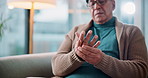 Arthritis, relax and senior man with hand pain, injury or muscle sprain in living room at nursing home. Osteoporosis, parkinson disease and elderly male person with wrist inflammation or fibromyalgia