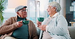 Coffee, laughing and retirement with senior couple on sofa in living room of home together. Bonding, funny or happy with old man and woman drinking caffeine beverage in apartment for relax or romance