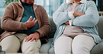 Argument, hands and senior couple on sofa in living room for divorce, separation or breakup. Fighting, conflict and elderly people for marriage crisis, disagreement or communication problem in home.