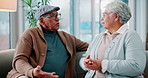Argument, upset and senior couple on sofa in living room fro divorce, separation or breakup. Fighting, conflict and elderly people for marriage crisis, disagreement or communication problem in home.