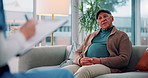 Advice, counseling or writing with patient and therapist on sofa in clinic for consulting or help. Clipboard, healthcare or medical with counselor and senior man in office for anxiety or psychology