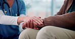 Comfort, empathy or holding hands with nurse and patient in retirement home for assisted living or support. Consulting, healthcare or medical with caregiver and old person closeup in apartment