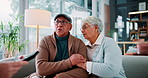 Clipboard, senior couple and stress with financial advisor on sofa in living room of home. Budget, consulting or recession with broker, old man and woman in apartment for insurance or investment