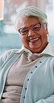 Face, home and old woman with smile, funny and humor with happiness, relaxing and retirement. Portrait, pensioner and senior person with weekend break, glasses and pride with laughing or elderly care