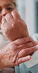 Elderly woman, hands and pain in wrist with tension, arthritis complication and poor blood circulation in home. Senior person, closeup and sore with joint inflammation, osteoporosis and carpal tunnel