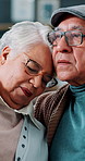 Sad, comfort and senior couple in home together with embrace, love and grief in retirement. Support, empathy and old man with woman, hug and compassion for bad news, loss and kindness in marriage