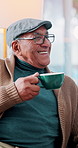 Coffee, conversation and senior man in living room of home with cup for break or refreshment. Happy, laughing and retirement with old person drinking caffeine beverage in apartment for wellness