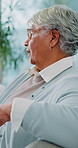 Home, angry and old woman in living room, argument and annoyed with disagreement, fight or apartment. Retirement, thinking and senior person with frustration, conflict and talking in lounge or stress