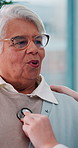 Senior woman, breathing and doctor with stethoscope for heart rate, checkup or appointment at hospital. Elderly, female person or patient with nurse for health exam, test or diagnosis at clinic visit