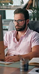Serious, employee and man with glasses, computer and financial analyst with info for project and online. Business, typing and person with tech for data analysis, chart and research for market trends