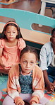 Education, listening and kids on floor of classroom for child development, learning games and growth. Academy, knowledge and future with group of students at school for studying, lesson and youth