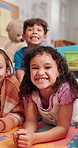 Education, smile and face of kids of classroom for child development, learning and growth. Academy, knowledge and future with group of students at school for studying, lesson and youth together