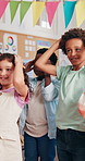 Happy children, classroom or activity with teacher for reaction, dance or learning together. Students, group or kids with smile for motion, movements or playing listening game with educator at school