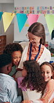 School, classroom and children hug teacher for greeting, welcome and excited for lesson. Academy, learning and happy educator with students embrace for bonding, child development and education