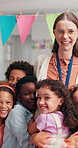 School, face and children hug teacher in classroom for greeting, welcome and excited for lesson. Portrait, learning and educator with students embrace for bonding, child development and education